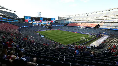 Getty Images Scotland fans seated waiting for the Scotland Haiti match to begin but many seats are still empty