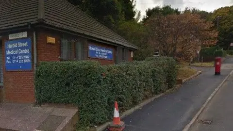 Harold Street Medical Centre in Walkley, a red-brick doctor's surgery with its name and contact numbers displayed on blue signs.