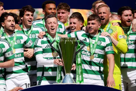 PA Media Celtic were presented with the Scottish Premiership trophy after the 1-1 draw against St Mirren