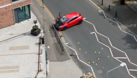 b60398d0-4d1f-11f1-ac78-2112837ce2aa.jpg Man charged after car hits five people in town centre