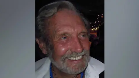 Jo Woodnut 87-year-old Martin Smith from Alderney smiling. He is looking away from the camera and is wearing a white shirt. 