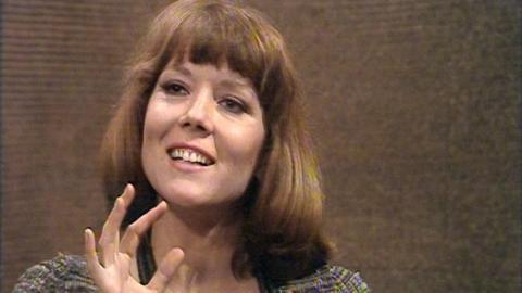 A close up of Diana Rigg in the studio.