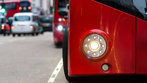 The front of a bus showing the front light 