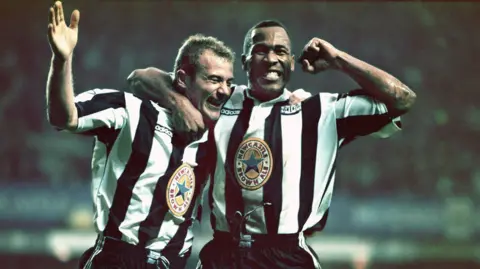 Getty Images Newcastle's Alan Shearer (left) and Les Ferdinand celebrate a goal in a 5-0 win over Manchester United in October 1996