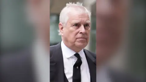 Andrew Mountbatten-Windsor wearing a suit 