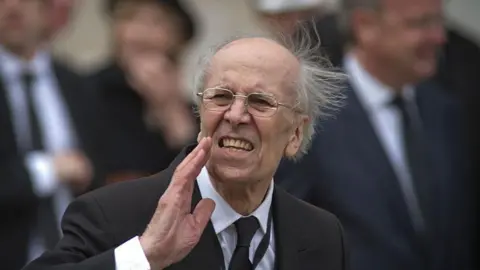 Getty Images Lord Tebbit calls to somebody in the crowd after Lady Thatcher's funeral in 2013
