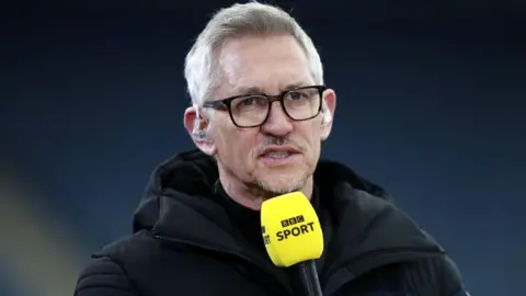 Gary Lineker talking into a BBC Sport mic