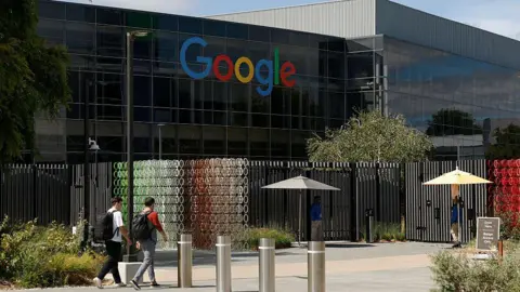 Getty Images To men walking towards the Google headquarters campus on 23 July 2025 in California's Mountain View