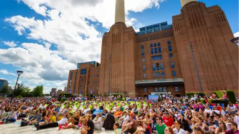 Charlie Round Turner Fans at fan zone at Battersea Power Station 