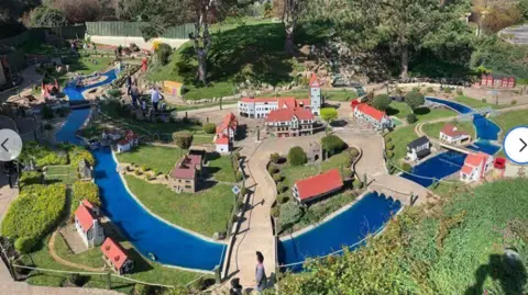 Southsea Model Village Small-sale model village with numerous buildings around a winding river.