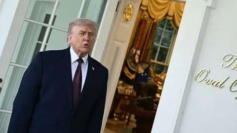 Donald Trump standing outside the Oval Office