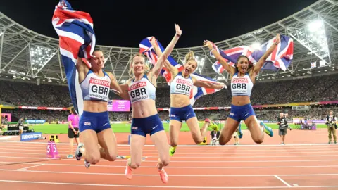 Zoey Clark, Laviai Nielsen, Eilidh Doyle and Emily Diamond of Great Britain celebrate winning silver in the women's 4x400m relay at the 2017 World Athletics Championships in London