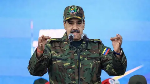 Nicolás Maduro pictured in military clothing during a ceremony 