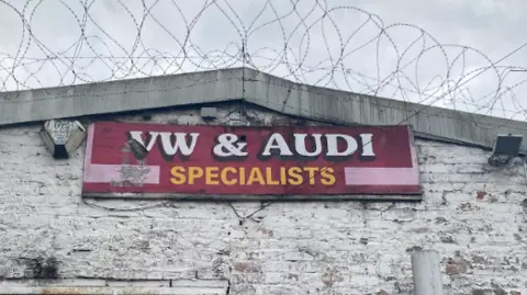 Red sign reading: 'VW and Audi specialists'