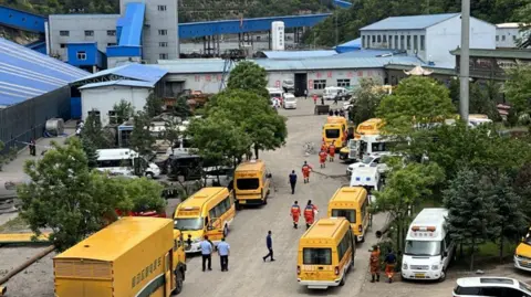 An aerial shot of emergency vehicles at the site of the mine explosion in China's Shanxi province
