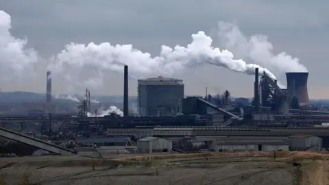 Chimney stacks and other buildings - part of Scunthorpe's steelworks - dominate the town's skyline