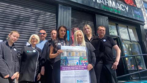 Protesting pharmacists outside a shop in Wirral