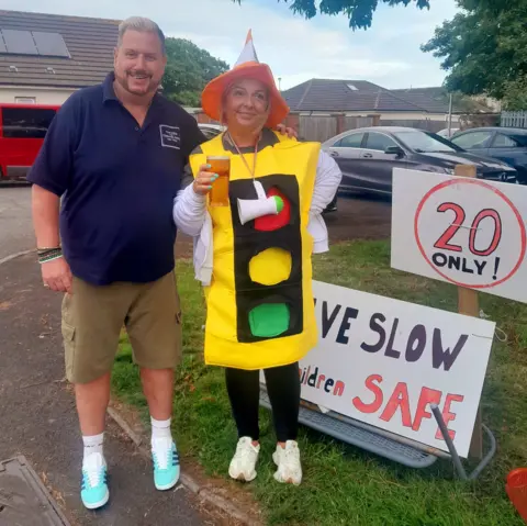 Faye and Garry posing for a picture together at the vigil.