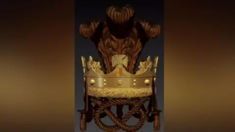 Anthony Frith The artist's impression of the design. It is a gold crown with darker gold knots and feathers and is against a brown background. 
