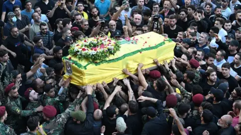 Getty Images Funeral ceremony held for 4 people who were killed in Lebanon when pagers used by Hezbollah members were detonated, in Dahiyeh neighborhood, south of the capital Beirut, Lebanon on September 18, 2024