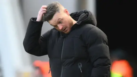 Middlesbrough manager Kim Hellberg scratches his head from the touchline as he tries to figure out their slump.