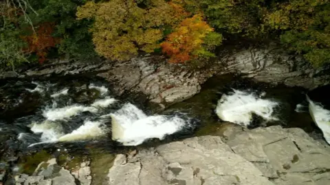 Ribble Rivers Trust A waterfall with three levels. 