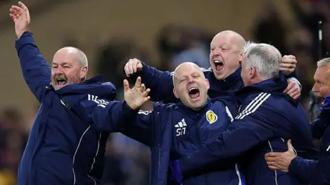 Steve Clarke and backroom staff celebrate