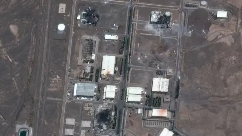 A satellite image shows damaged structures at the Natanz nuclear facility following Israeli air strikes (14 June 2025)