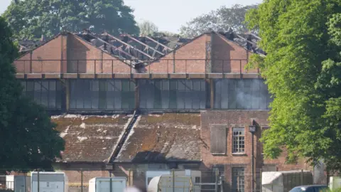 Damaged buildings following a fire at Bicester Motion.