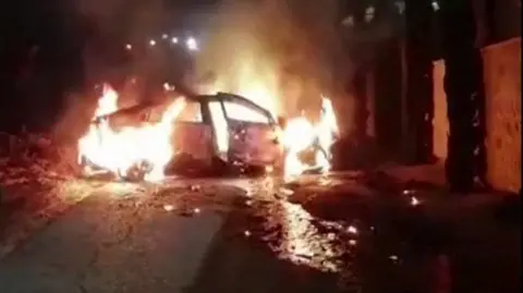 Reuters A still from footage purportedly showing a burning car in the Palestinian village of Jit in the occupied West Bank on 15 August 2024