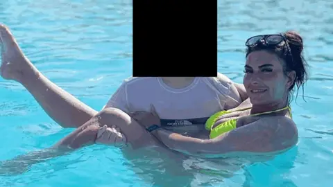 PA Media Catherine Wieland posing in a swimming pool. 