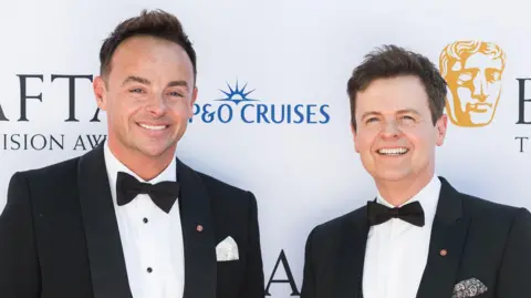 Getty Images Ant and Dec are seen in a suit and tie 