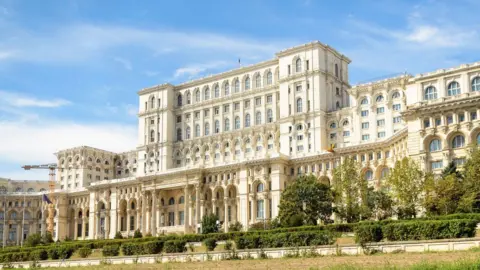 Getty Images A photo of Romania's constitutional court, a grand white building several storeys high and stretching wide across the frame