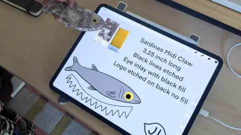 Zoe Corbyn A tablet showing one of Jenny Lennick's designs, for a sardine