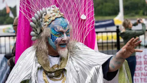 DCSDC Man in god of the sea costume taking part in Derry's marime festival parade