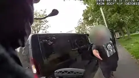 A van driver pulled over to help an armed officer catch a suspect