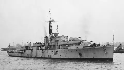Hulton-Deutsch Collection/CORBIS/Corbis via Getty Images A black and white image of a Royal Navy warship in the sea.