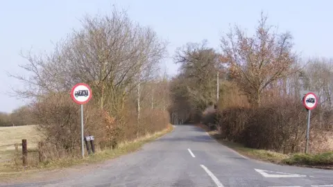 The junction of Bow Hill onto Watton Road on the B1108. 