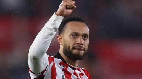 Lewis Baker salutes the Stoke City fans during a clash with Bristol City in November