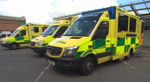 A photo of three ambulances