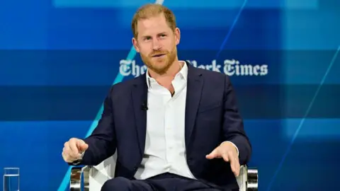 Eugene Gologursky / Stringer/Getty Images Prince Harry speaking on stage