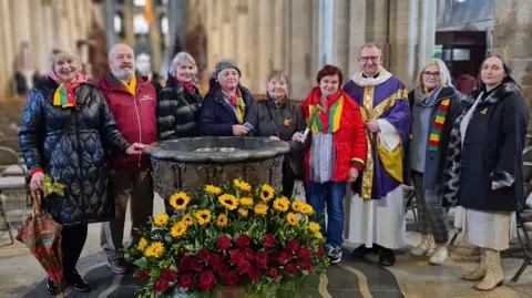 Judita Gru Members of the community attending the prayer 