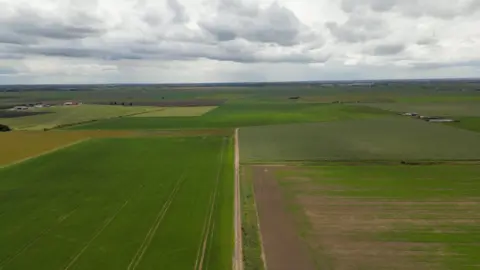 An aerial image of the area the reservoir is due to be built on. It shows a patchwork of green fields with the buildings of Chatteris faintly visible in the distance.