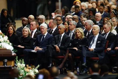 Getty Images Kamala Harris, Hillary Clinton, Bill Clinton, Barack Obama, Jill Biden and Joe Biden sit along one row at the public memorial service for Reverend Jesse Jackson.