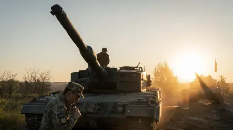 Getty Images Ukrainian soldiers operate a German-made Leopard2 tank. File photo