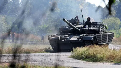 Ukrainian tank drives on the road on September 16, 2024 in Kursk Region, Russia