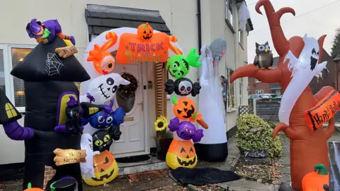 Photo of Halloween decorations in the front garden of a house in Wythenshawe.