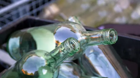 used glass bottles in a crate