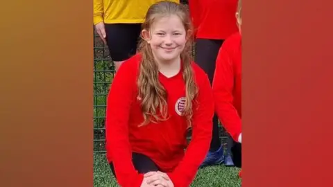 Family handout Leah Harrison in a football kit