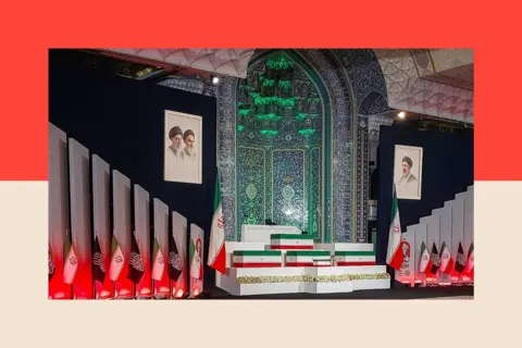 Getty Images Coffins draped in the Iranian flag sit on a podium flanked by flags and portraits of the ayatollahs